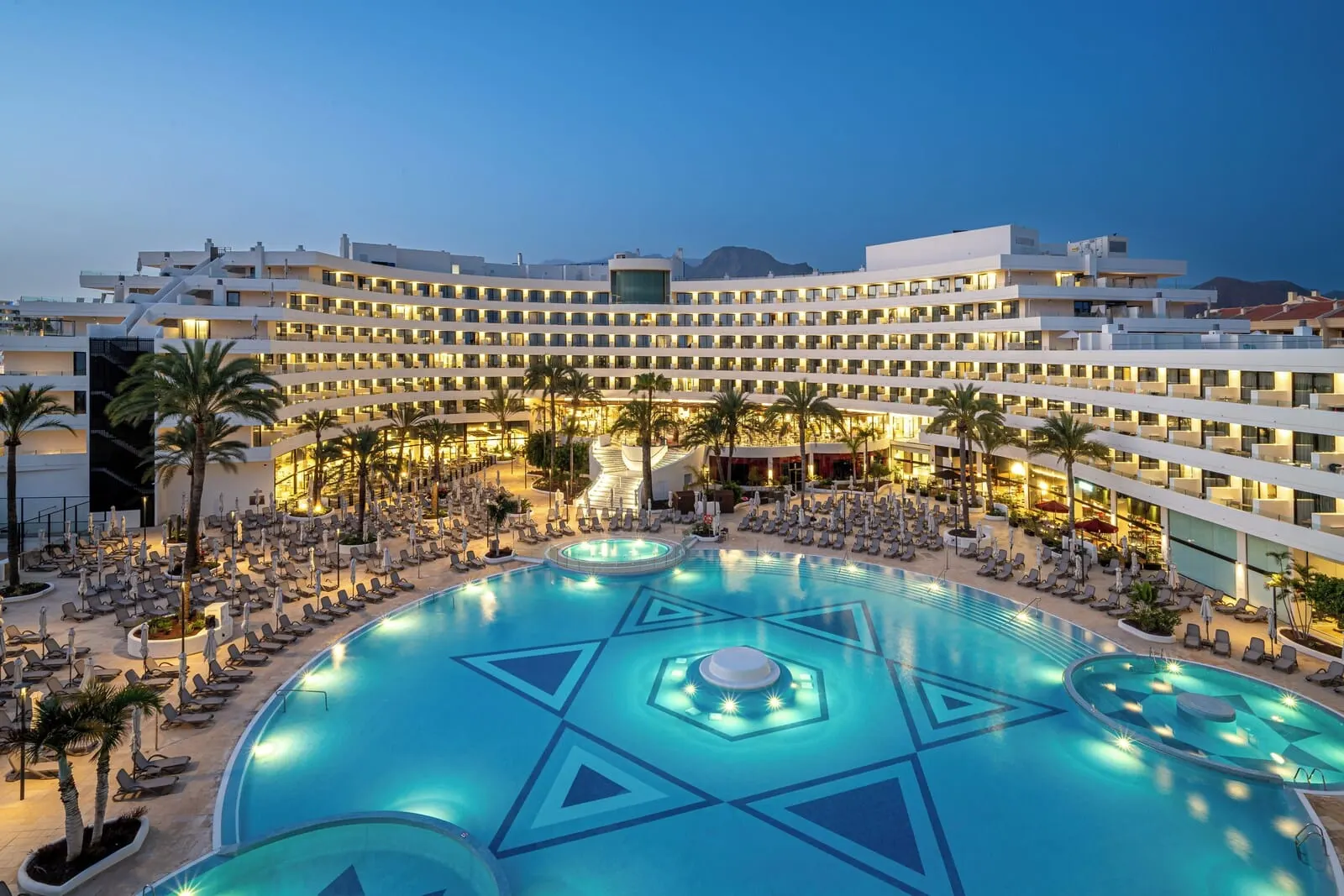 Mediterranean Palace: A hotel with a large swimming pool, multiple floors, and a modern design