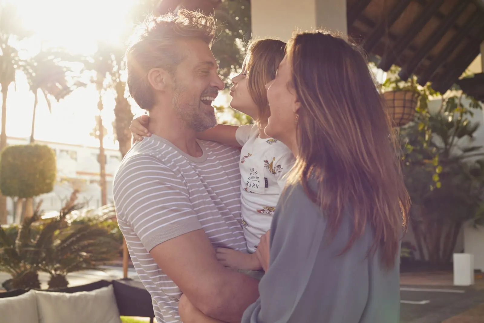 Hyatt Ziva Jardín Tropical Tenerife: A couple embracing outdoors with a building and plants in the background