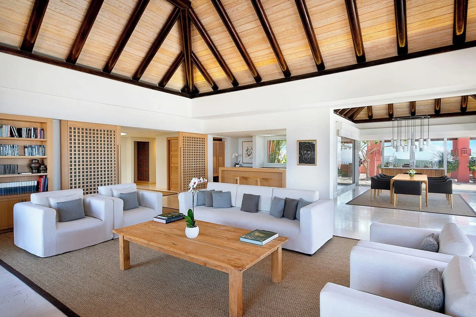 The Ritz-Carlton Tenerife, Abama: A spacious living area with a high ceiling, a white sofa set, a wooden coffee table