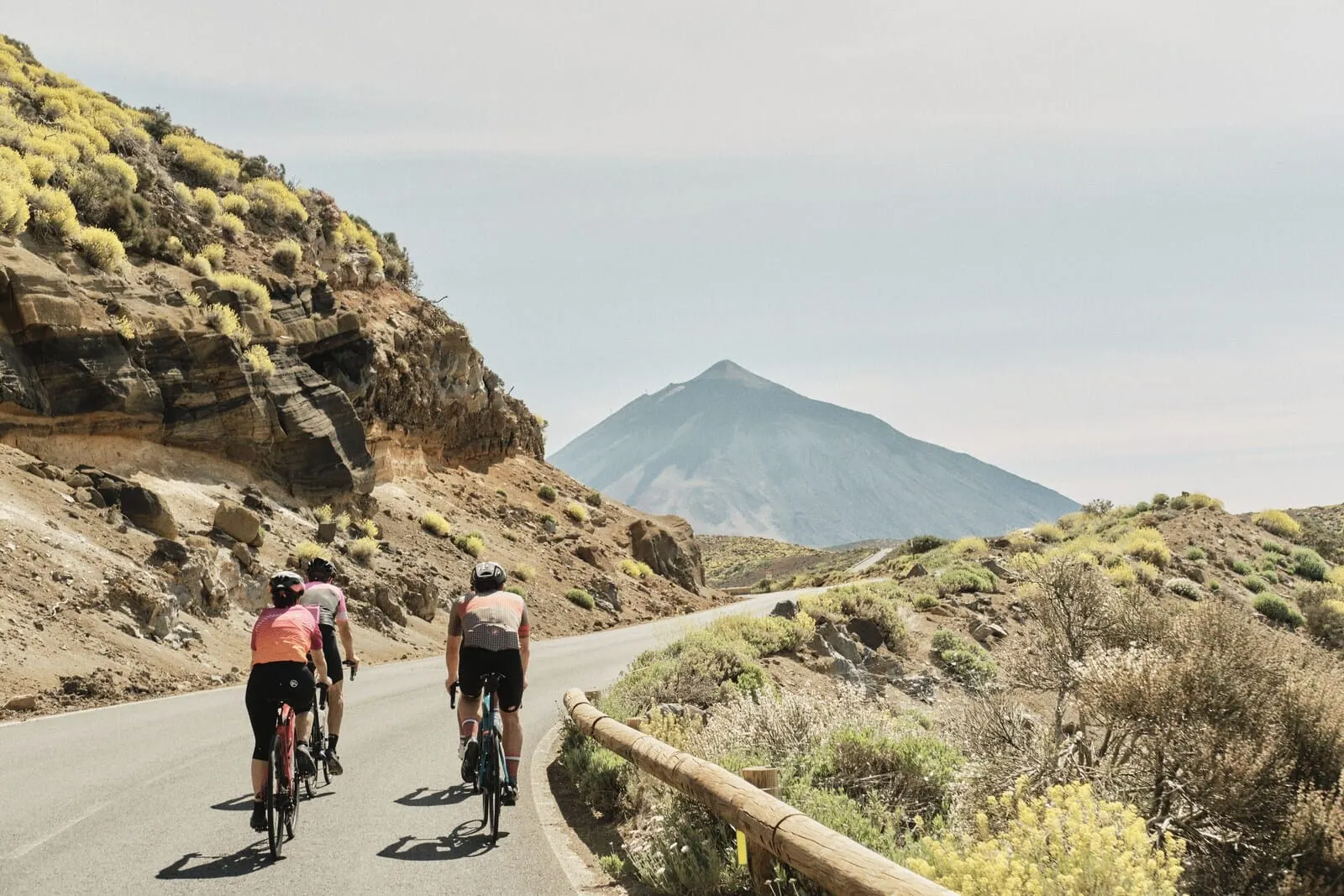 Playa Surf CBbC Hotel: A group of cyclists on a paved road with a mountain in the background