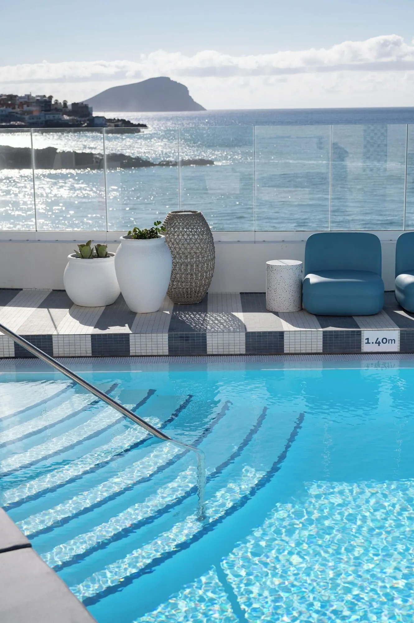 The Salmar: A pool area with clear blue water, a metal pool ladder