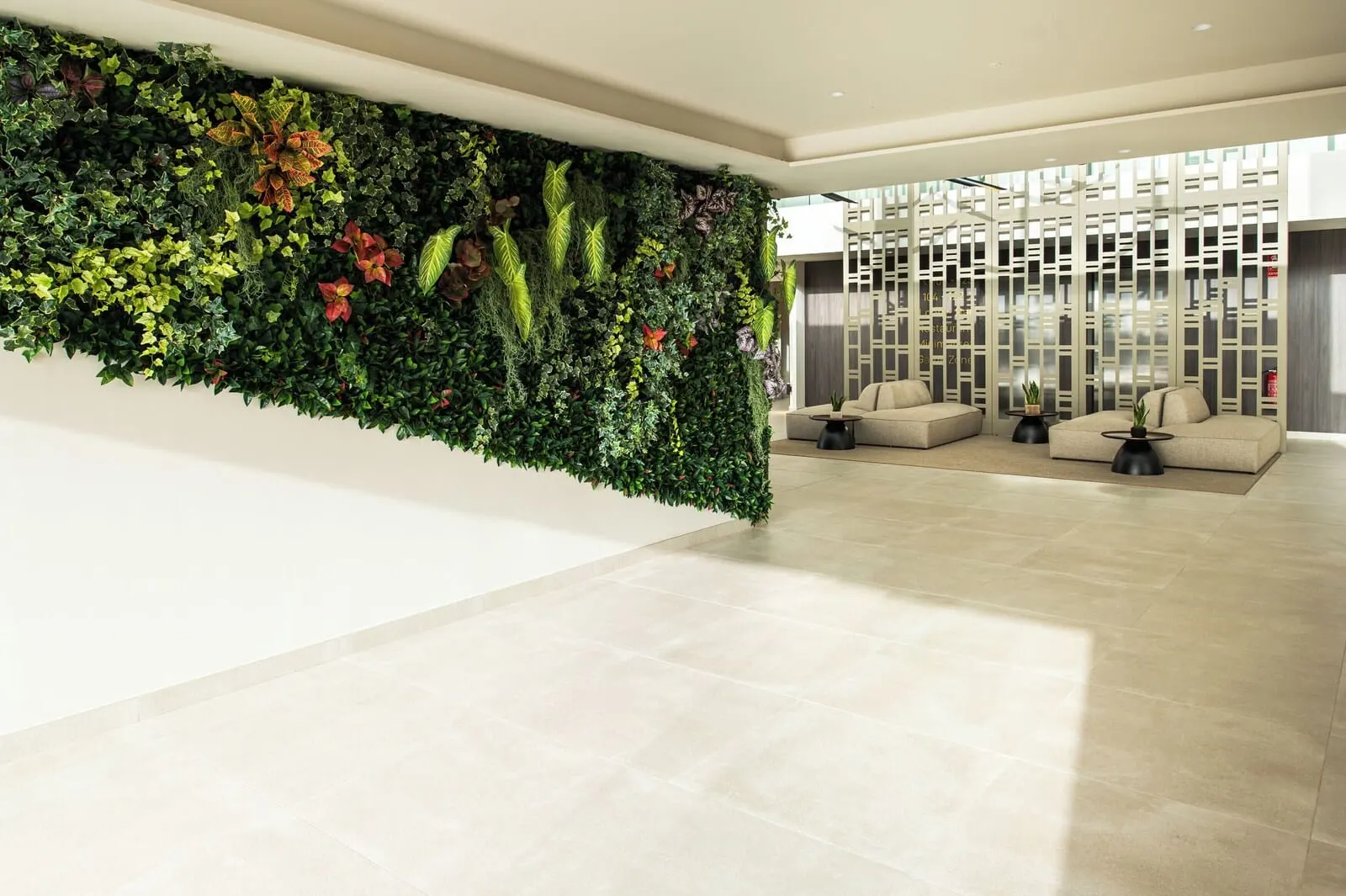 Amarilla Golf Residences: A modern lobby with a vertical garden wall
