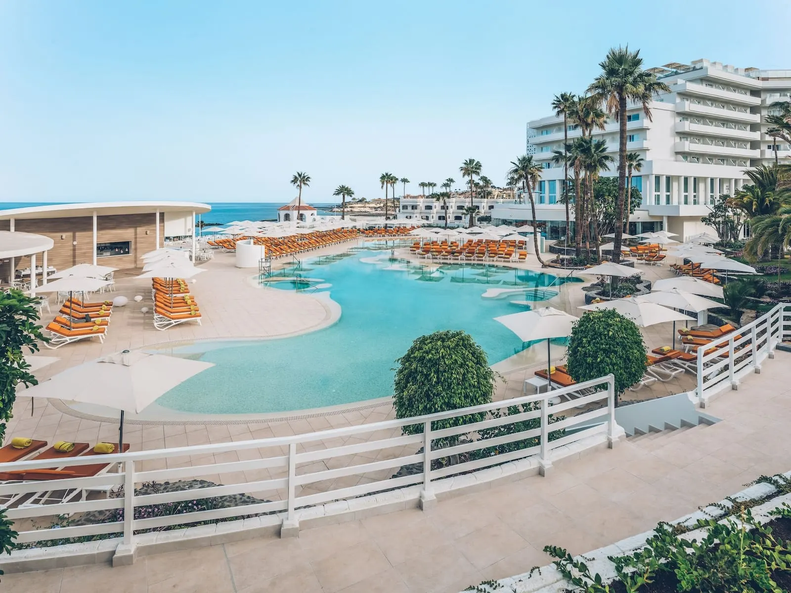 Iberostar Selection Sábila: A resort pool area with multiple sun loungers and umbrellas