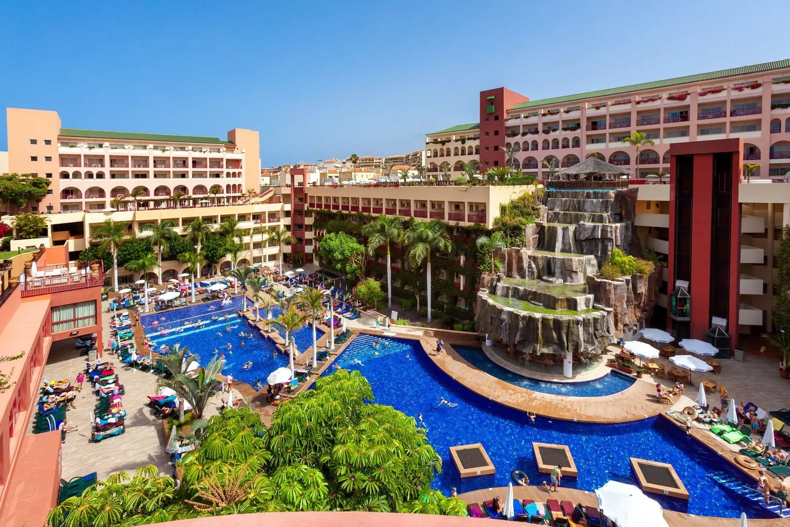 Best Jacaranda: A resort with multiple swimming pools, a central waterfall feature