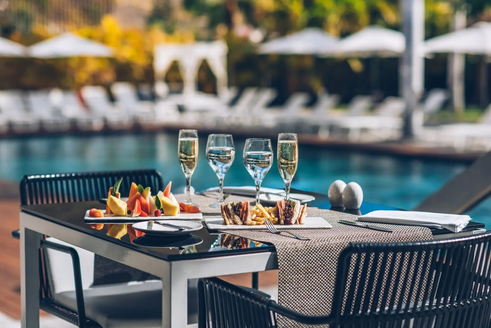 Iberostar Heritage Grand Mencey: A dining table with a meal, glasses of white wine
