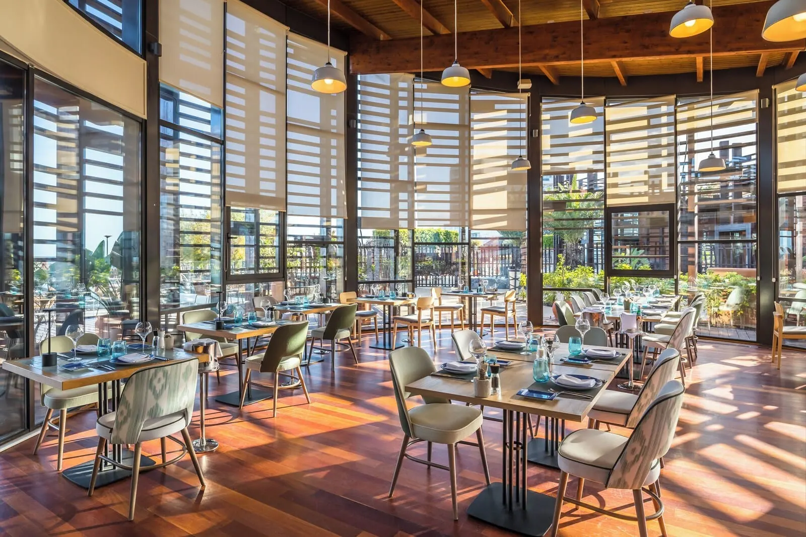 Barceló Tenerife: A spacious restaurant with large windows, wooden floors