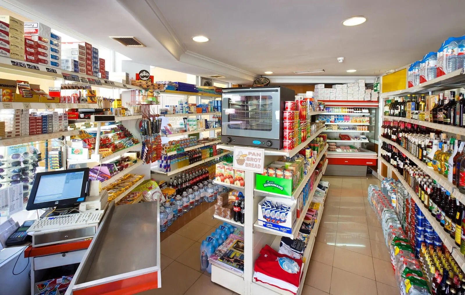 GF Noelia: A well-organized convenience store with a variety of products including snacks