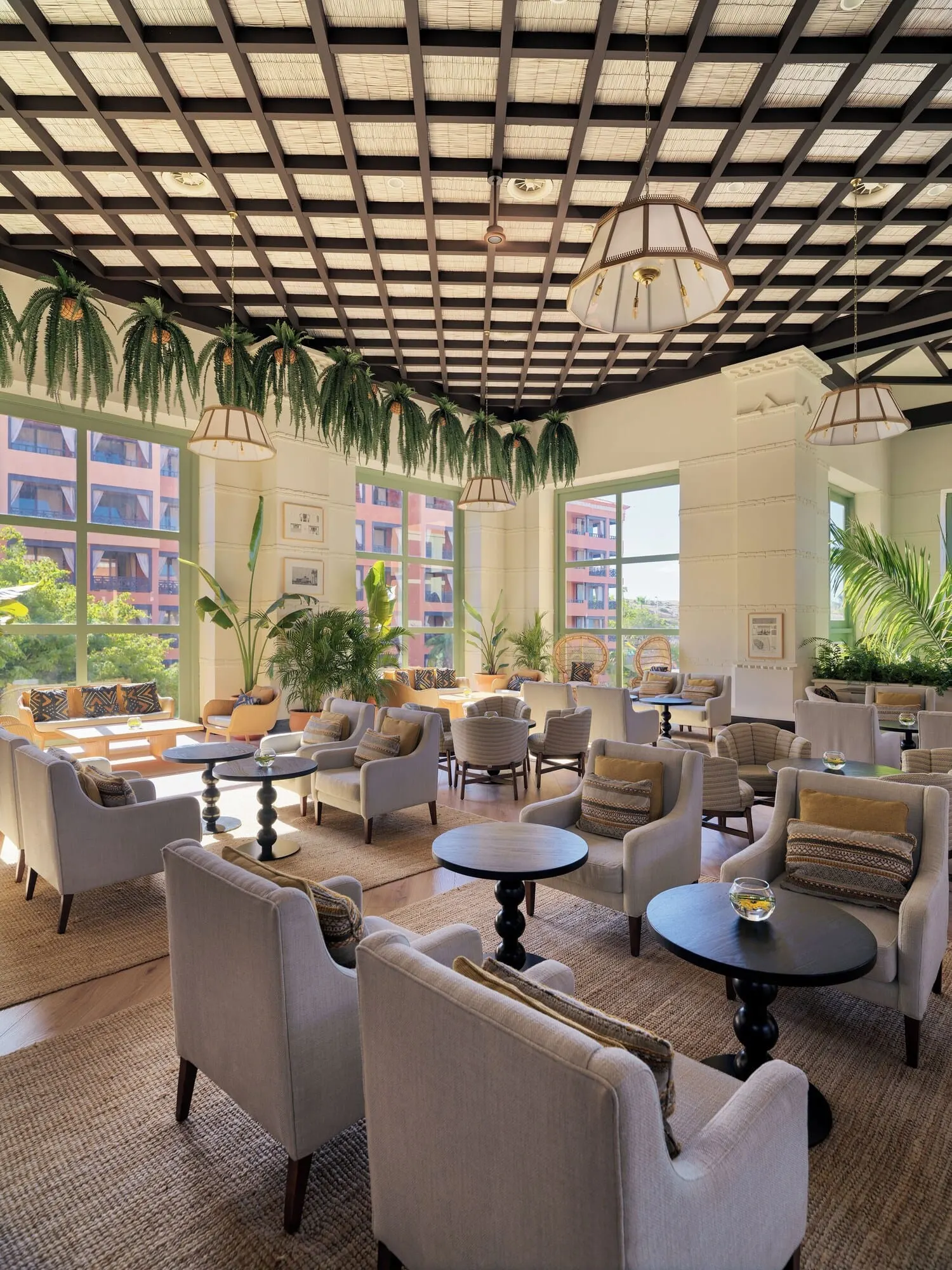 H10 Costa Adeje Palace: A spacious lounge area with multiple seating options, including sofas and armchairs